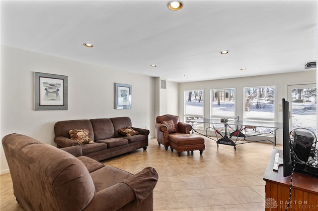 living area with recessed lighting and visible vents