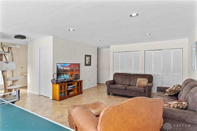 living room with baseboards and recessed lighting