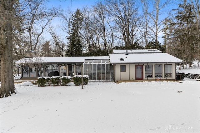 view of front of house featuring cooling unit and a sunroom