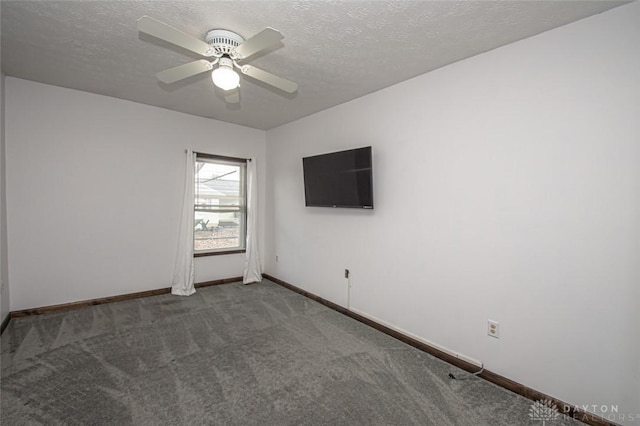 spare room with carpet, ceiling fan, a textured ceiling, and baseboards