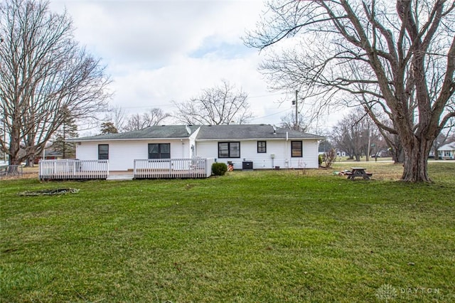 back of house featuring a yard, a deck, and central air condition unit