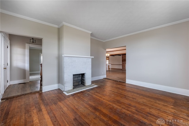 unfurnished living room with ornamental molding, a fireplace, baseboards, and hardwood / wood-style flooring