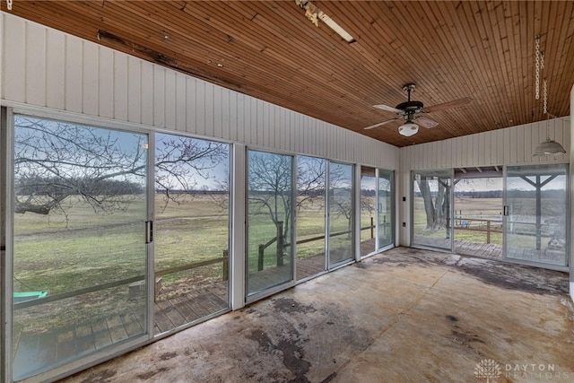 unfurnished sunroom with wooden ceiling and ceiling fan