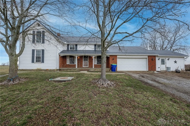 traditional-style home with a garage, central AC, brick siding, dirt driveway, and a front lawn