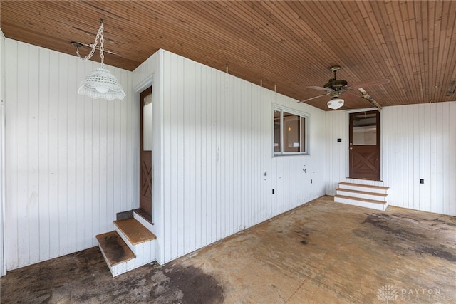 doorway to property with a ceiling fan and a patio