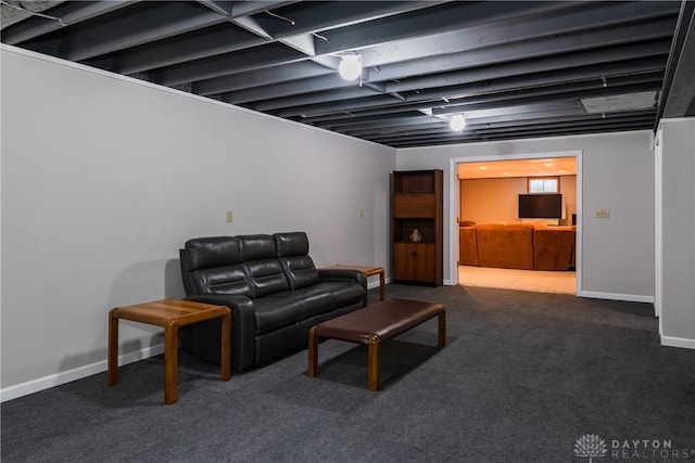 living room featuring carpet floors and baseboards