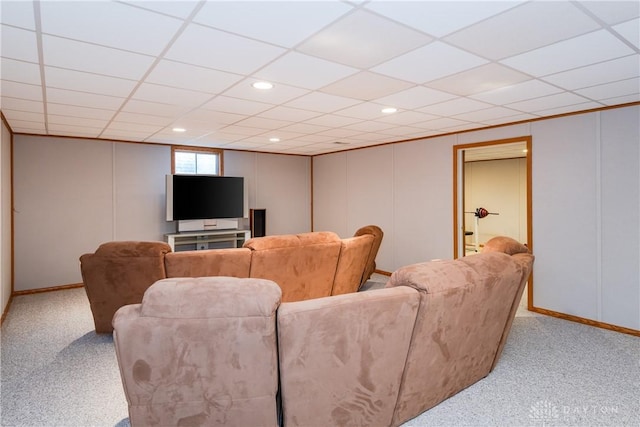 carpeted home theater featuring a decorative wall, a drop ceiling, and recessed lighting