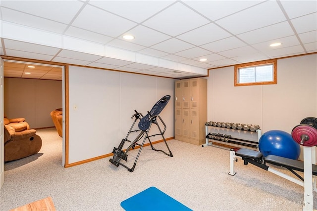 exercise area with a drop ceiling, carpet flooring, and recessed lighting