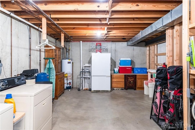 unfinished basement with separate washer and dryer, gas water heater, and freestanding refrigerator