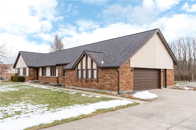 view of front of property featuring an attached garage, brick siding, concrete driveway, roof with shingles, and a lawn