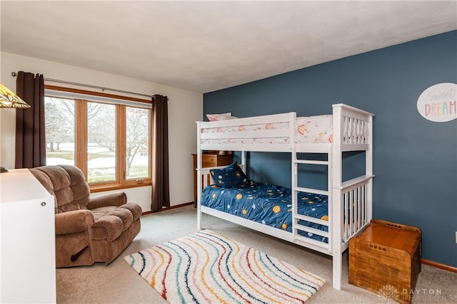 bedroom featuring carpet flooring and baseboards