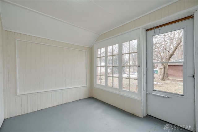 unfurnished sunroom featuring lofted ceiling and plenty of natural light