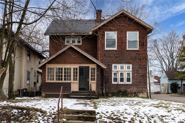 view of front facade with a chimney