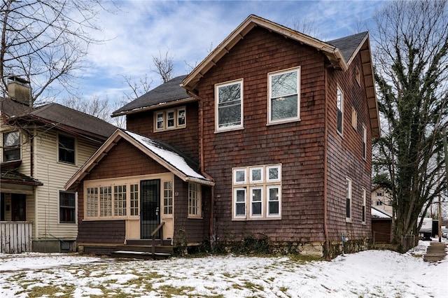 snow covered house with entry steps