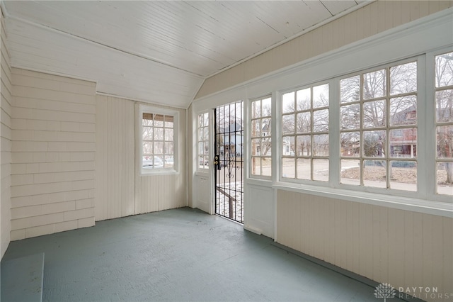 unfurnished sunroom with vaulted ceiling