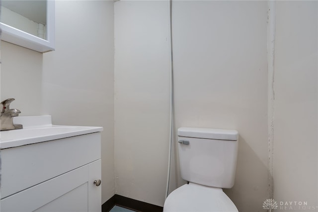 bathroom with toilet and vanity