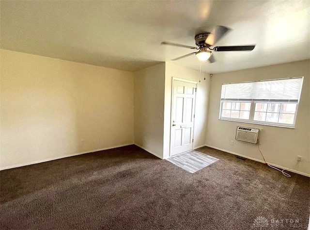 unfurnished bedroom with dark colored carpet, a ceiling fan, and a wall mounted air conditioner