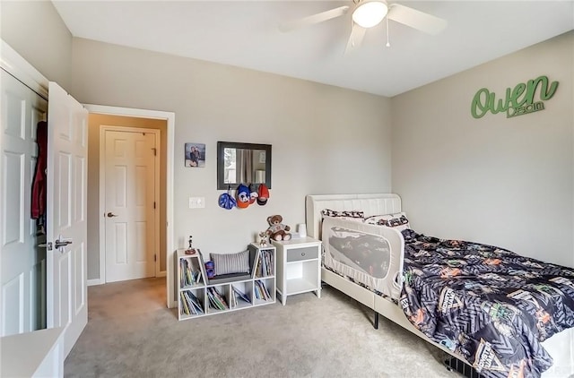 carpeted bedroom with ceiling fan