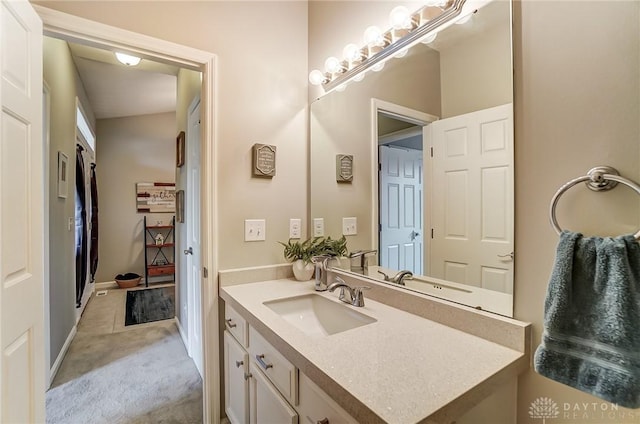 bathroom featuring vanity and baseboards