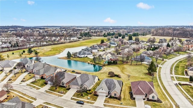 drone / aerial view featuring a water view and a residential view