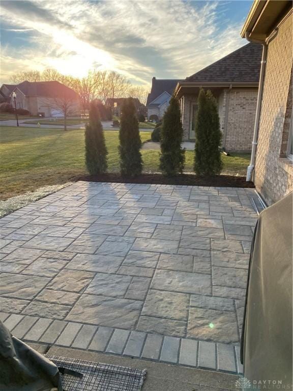 patio terrace at dusk with a lawn