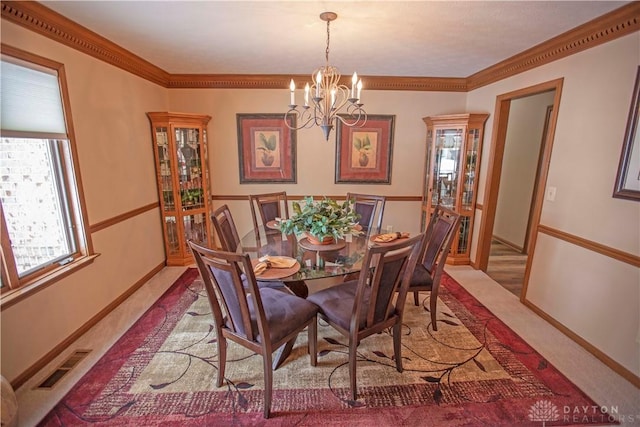 carpeted dining space with a chandelier, visible vents, crown molding, and baseboards