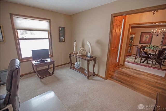 1250 Yankee Woods Dr, Washington Twp, OH 45458 - office area with a chandelier, carpet, and baseboards