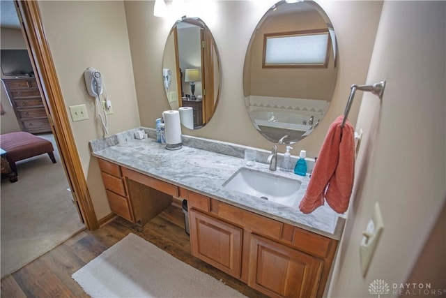 1250 Yankee Woods Dr, Washington Twp, OH 45458 - bathroom featuring wood finished floors and vanity