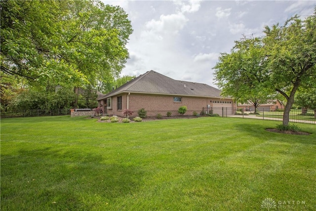 1250 Yankee Woods Dr, Washington Twp, OH 45458 - view of side of home featuring a garage and brick siding
