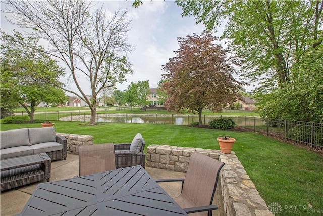 1250 Yankee Woods Dr, Washington Twp, OH 45458 - view of patio / terrace featuring a water view, an outdoor hangout area, and outdoor dining space