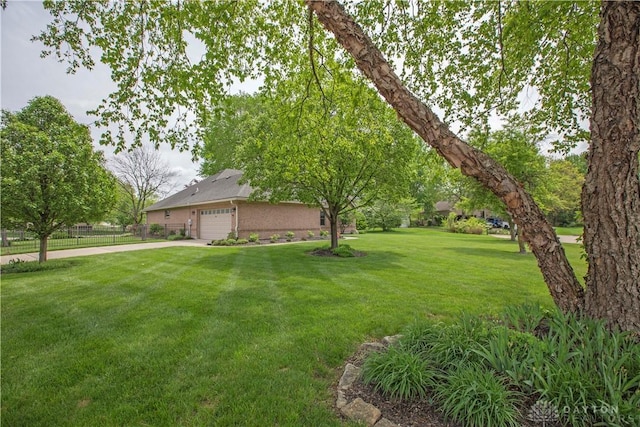 1250 Yankee Woods Dr, Washington Twp, OH 45458 - view of yard with a garage
