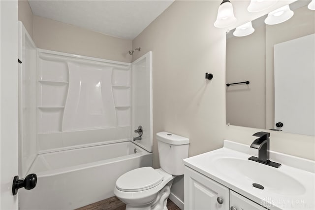 bathroom featuring toilet, shower / bathing tub combination, wood finished floors, and vanity