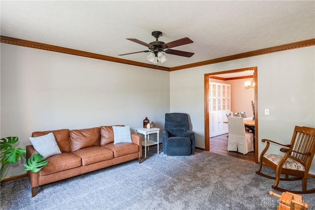 carpeted living room with ceiling fan, baseboards, and crown molding