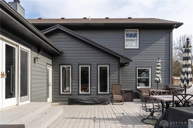 wooden deck featuring outdoor dining space