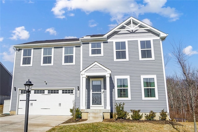 view of front of home featuring driveway and an attached garage