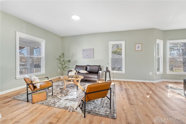 interior space with baseboards and wood finished floors