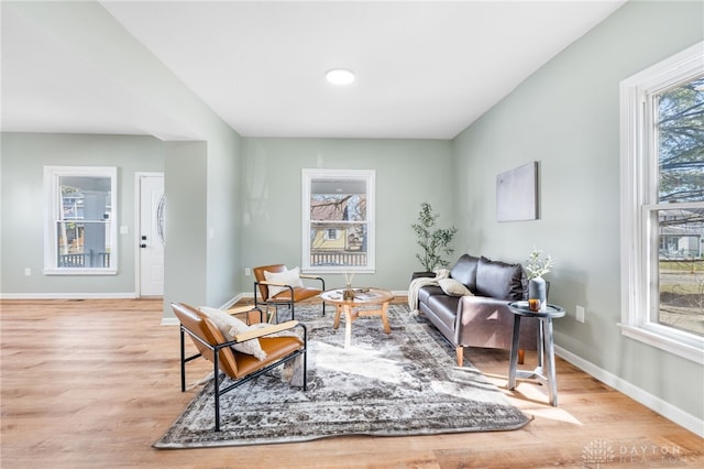 sitting room featuring baseboards and wood finished floors