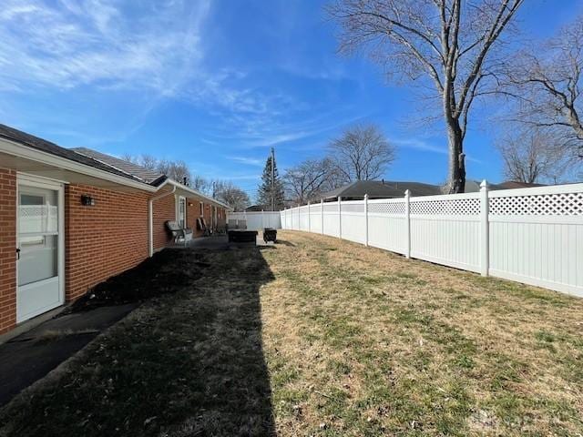 view of yard with a fenced backyard