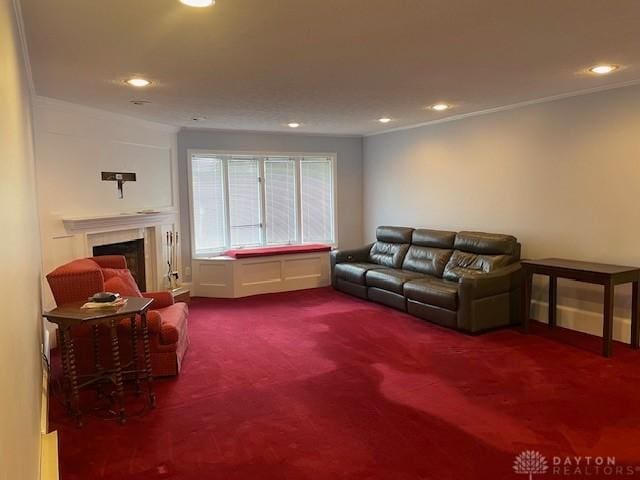 living room with carpet floors, recessed lighting, crown molding, and a fireplace