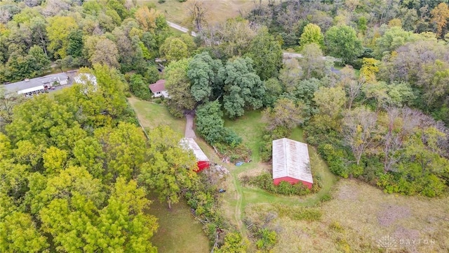 drone / aerial view featuring a forest view