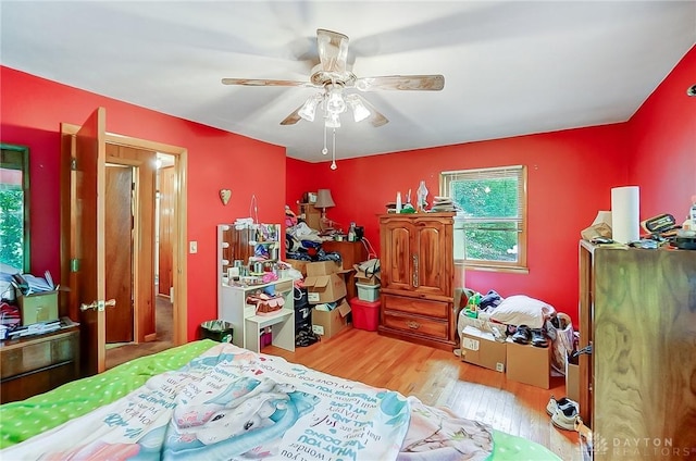 bedroom with wood finished floors and a ceiling fan