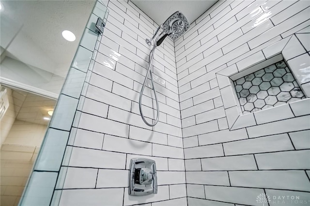 interior space featuring tiled shower