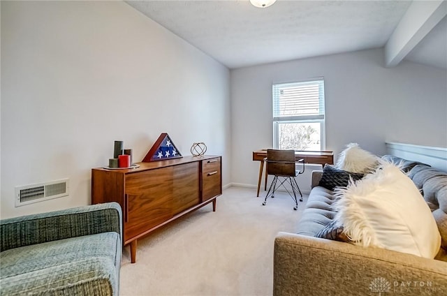 interior space featuring light carpet, baseboards, lofted ceiling with beams, and visible vents