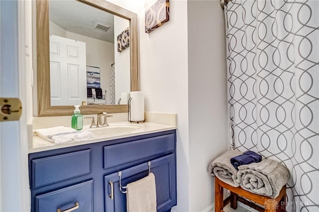 full bathroom featuring visible vents and vanity