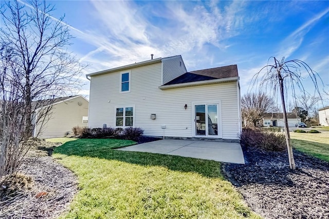 rear view of property featuring a lawn and a patio