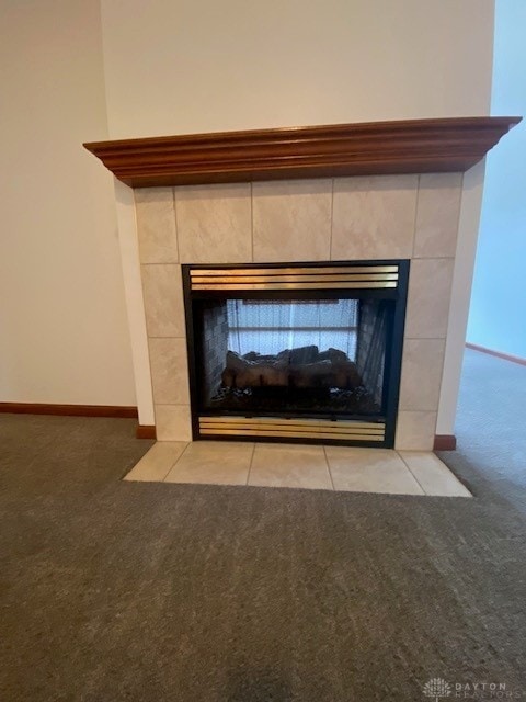 details with carpet floors, a fireplace, and baseboards