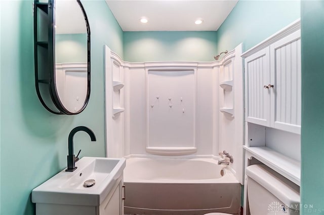 bathroom with shower / bathing tub combination, vanity, toilet, and recessed lighting