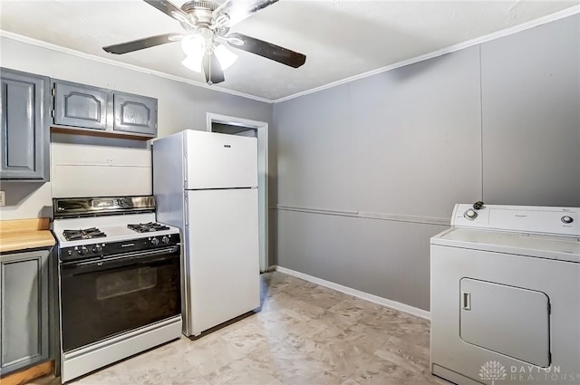 kitchen with range with gas cooktop, washer / clothes dryer, freestanding refrigerator, gray cabinets, and crown molding