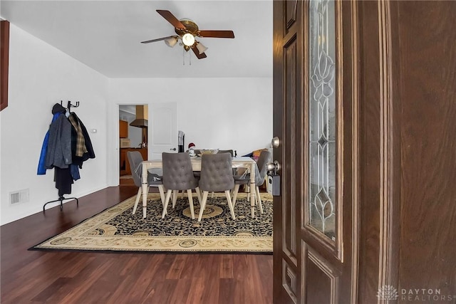 dining area featuring a ceiling fan, visible vents, and wood finished floors