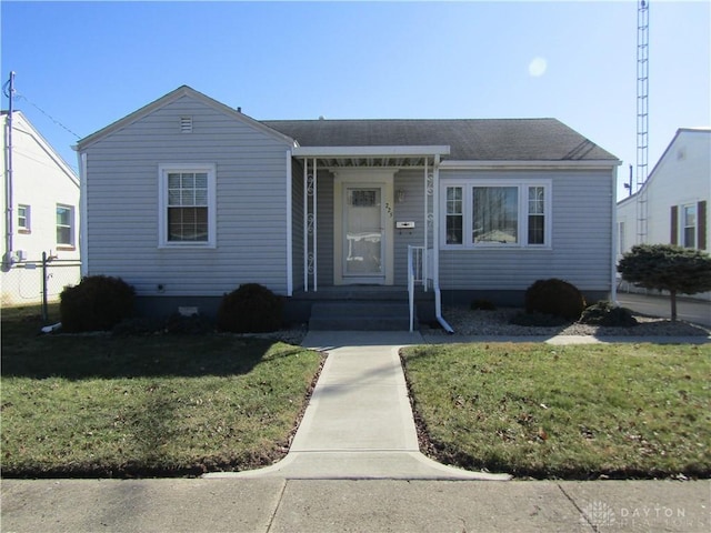 view of front of property with fence and a front yard